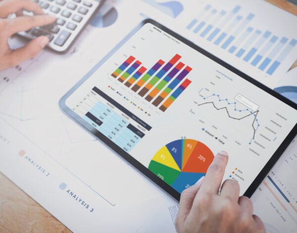 Businesswoman using a tablet to analysis graph company finance s Businesswoman using a tablet to analysis graph company finance strategy statistics success concept and planning for future in office room.