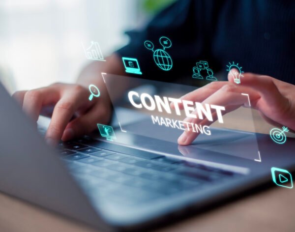 Content marketing concept with a woman working on a laptop on a Content marketing concept with a woman working on a laptop on a futuristic virtual interface screen.
